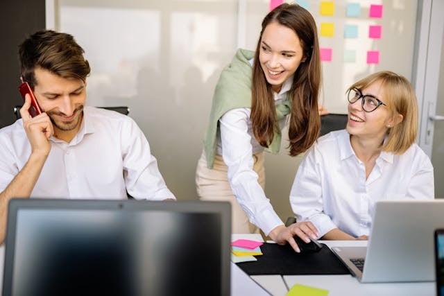 Healthcare team working together on revenue cycle software solutions